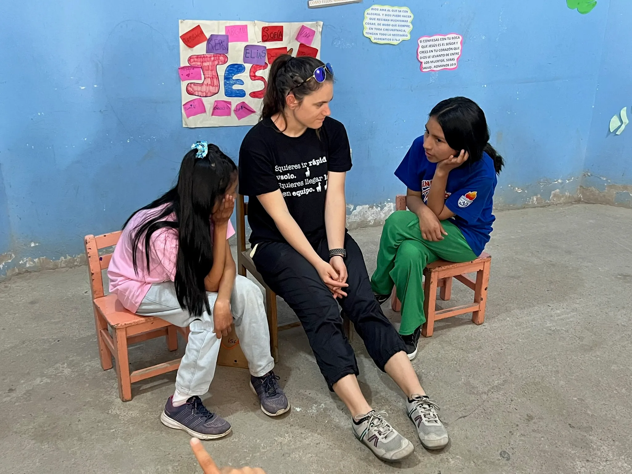 Children and young people on blue wall in Lima