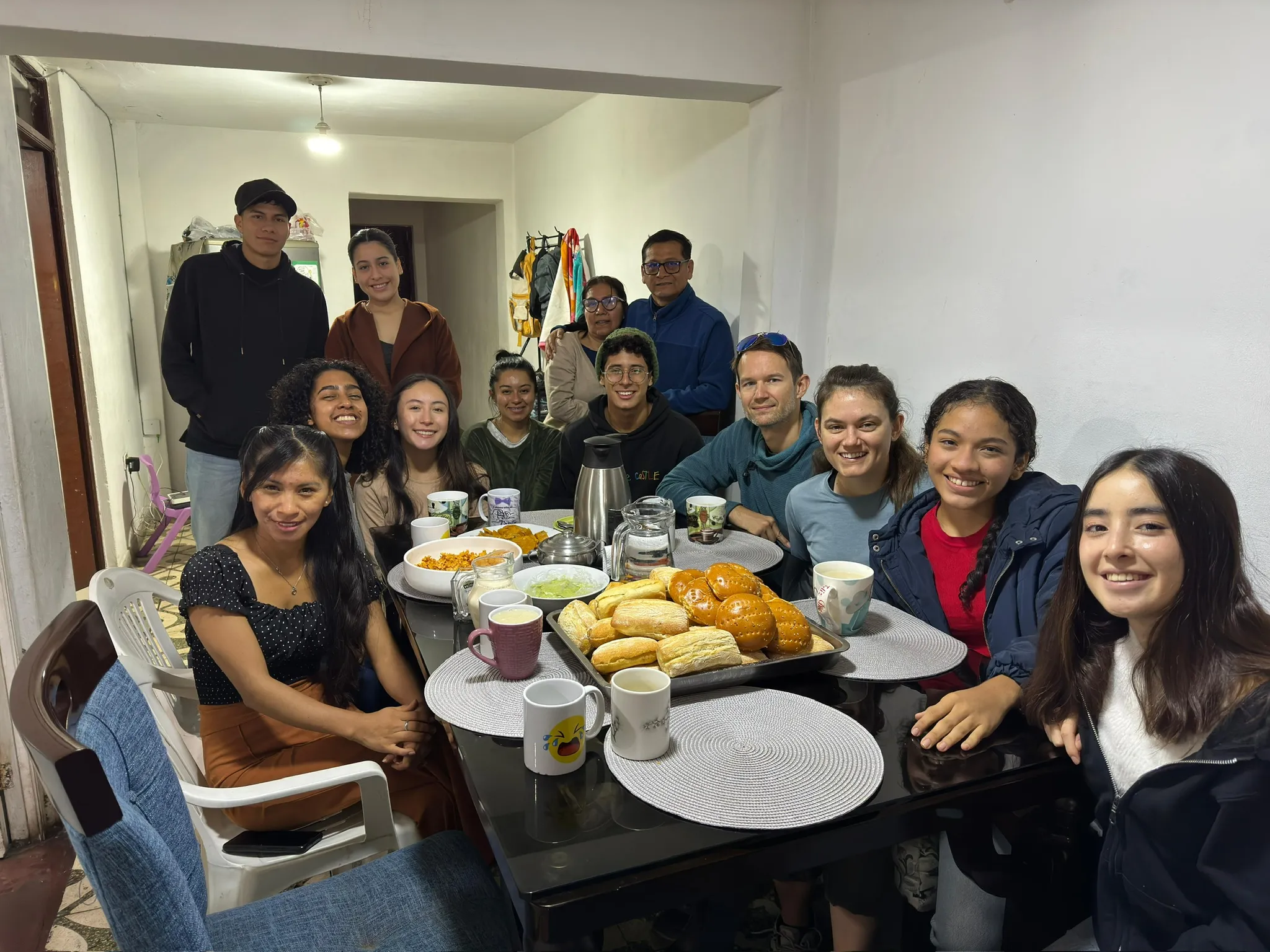 Students sharing a meal together around a table